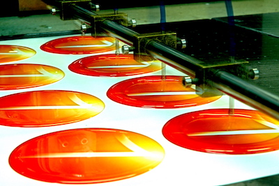 Circular adhesive stickers with resin droplet.